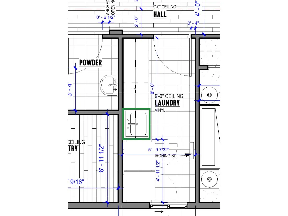 A2.1 · floor plan, boxed in green where it shows what belongs there: A2.1 puts it at the far end, next to the washer and dryer.